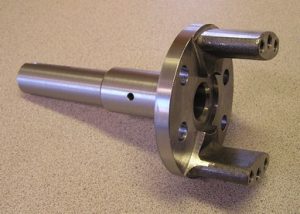 Gear box output shaft that is a1045 steel forging. CNC turned. The milling, drilling and tapping was done on a CNC vertical machining center.
