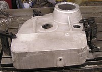 Large Aluminum casting held is custom fixture. Machined on a CNC vertical machining center